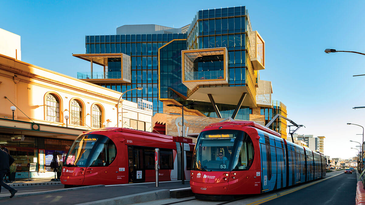 Newcastle light rail passing the UON NUspace Building